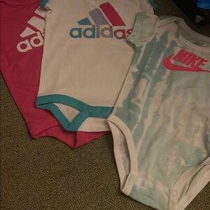 ADIDAS and Nike onesies